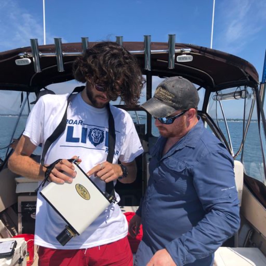 Dean conducting field research on the water